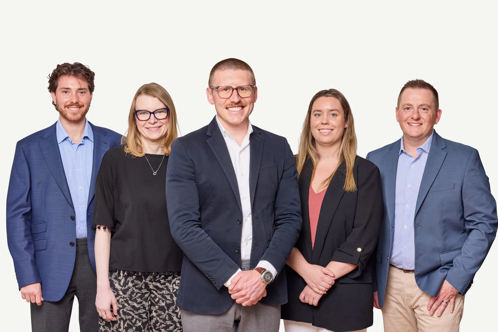 The five-person STRAND team, standing together.
